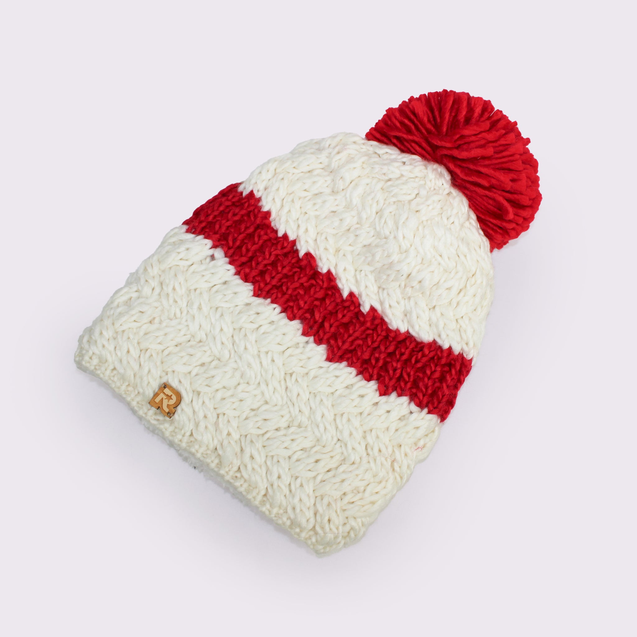 Herman（ヘルマン） ライン入りポンポンビーニー